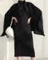 Pleated cape with tassel