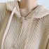 Pleated hooded button tunic