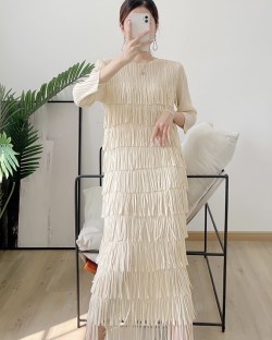 Pleated dress with tassel