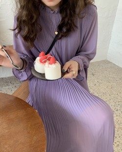 Pleated dress with sheer sleeves